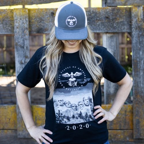 Mt Rushmore womens black front Woman wearing black Mt. Rushmore T-shirt from United States of American's Republic USOAR