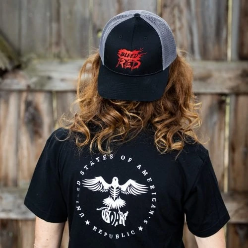 Woman wearing black Stand for the Flag T-shirt from United States of American's Republic USOAR