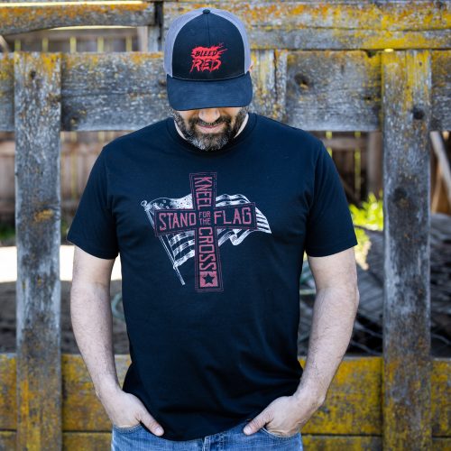 Man wearing black Stand for the Flag T-shirt from United States of American's Republic USOAR