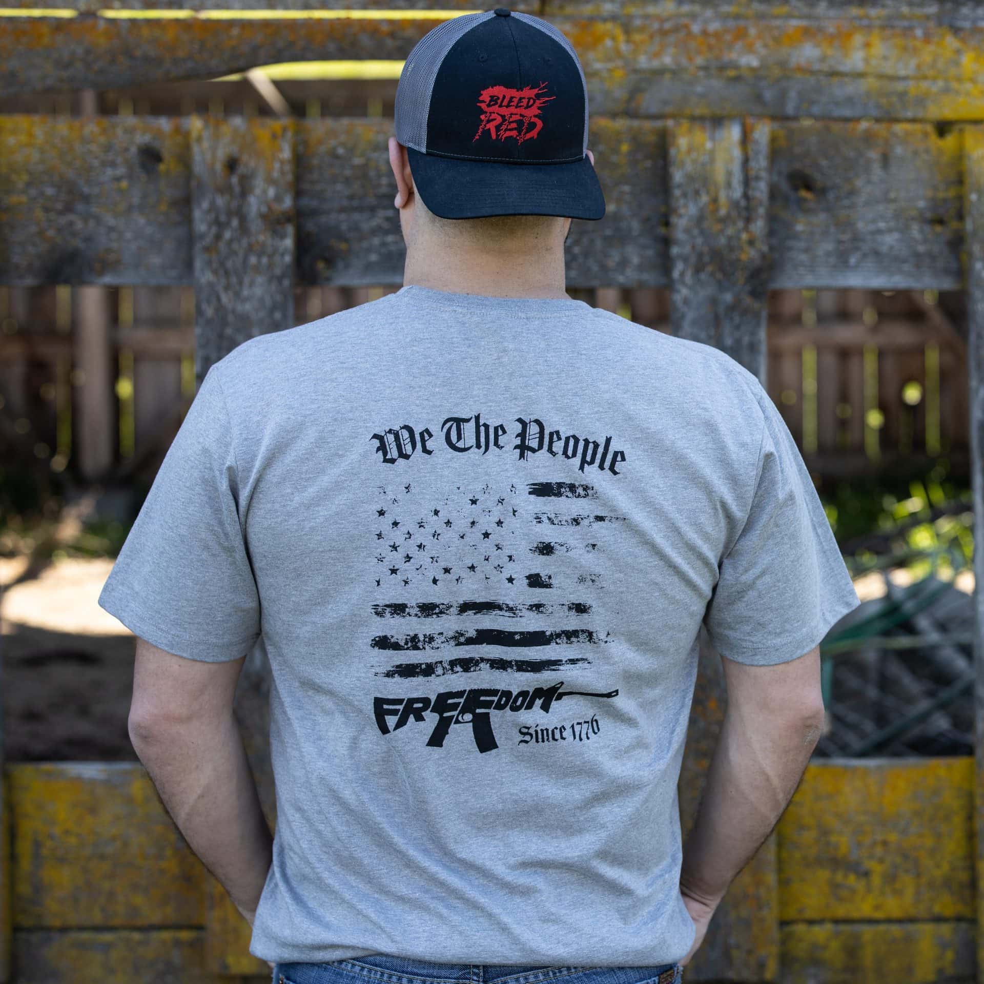 Man wearing gray We The People T-shirt from United States of American's Republic USOAR