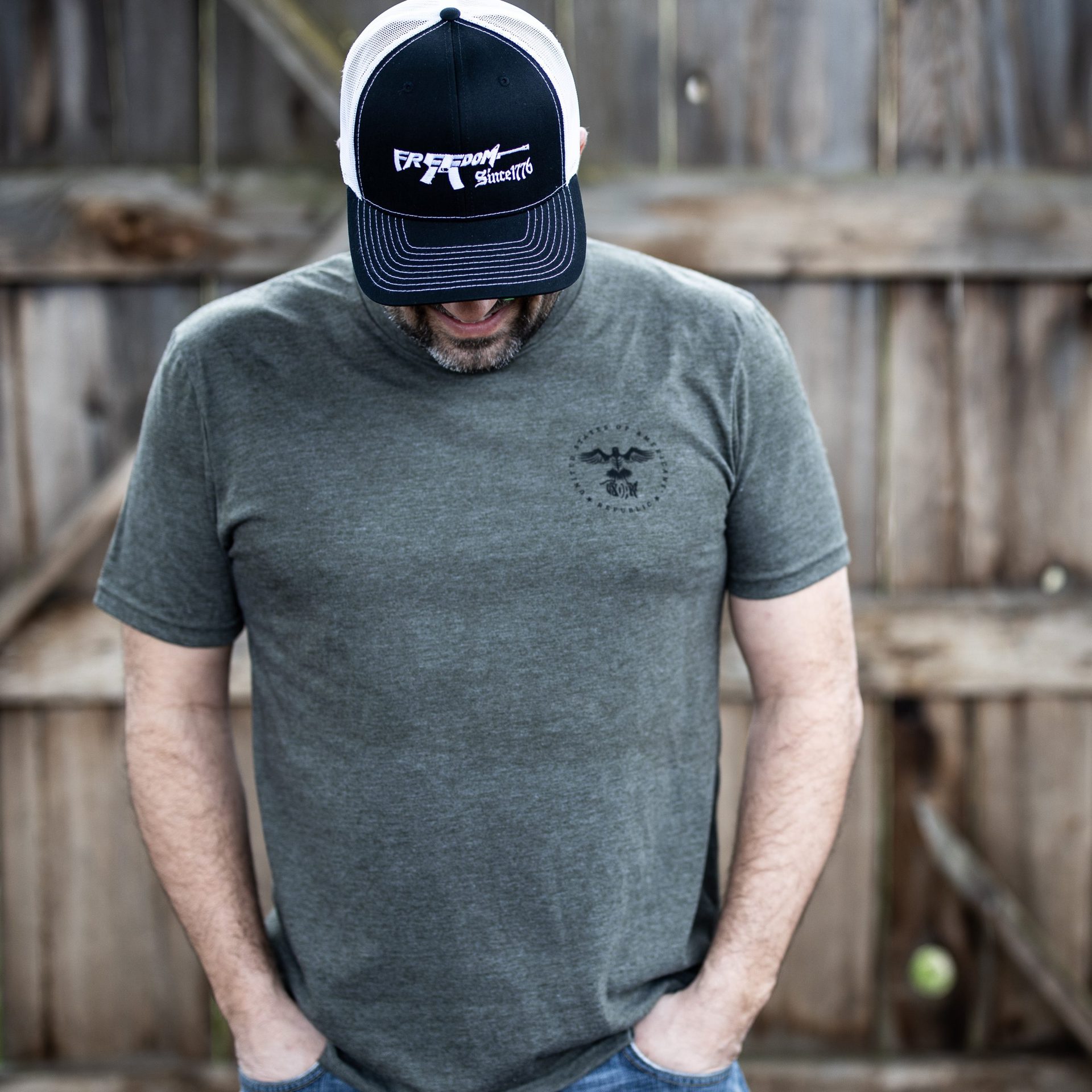 Man wearing olive green We The People T-shirt from United States of American's Republic USOAR