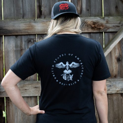 Woman wearing a black Trump Card USOAR T-Shirt from United States of American's Republic